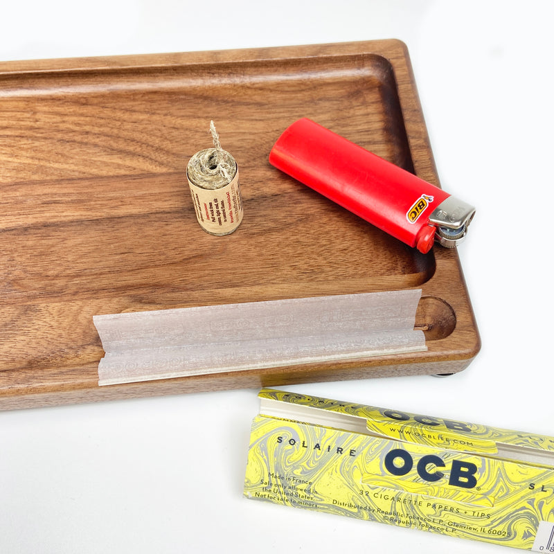 Rolling tray with paper notch